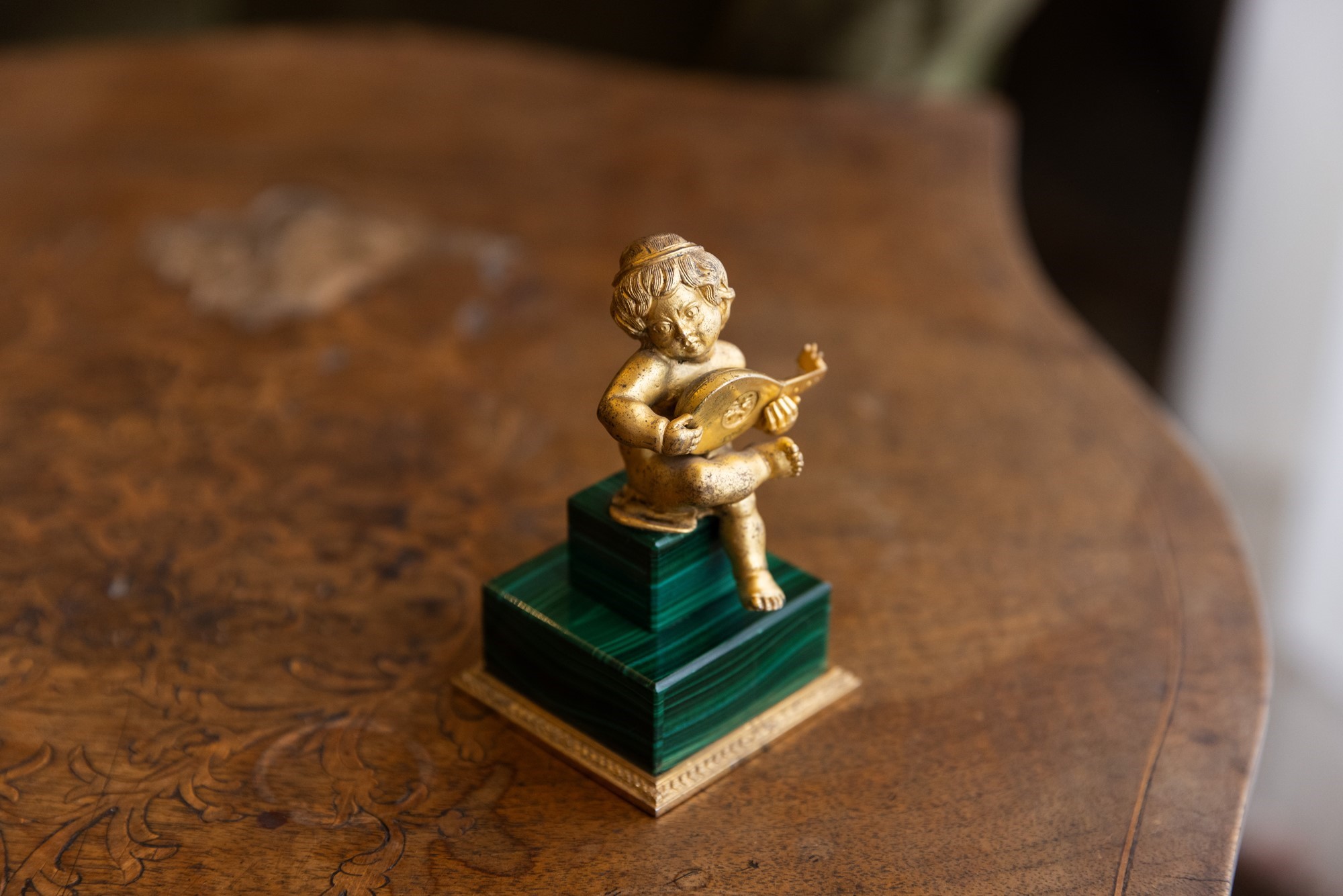 Putto in malachite e bronzo dorato
